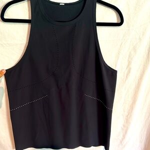 Black with reflective dots Lululemon workout top. Size 8
